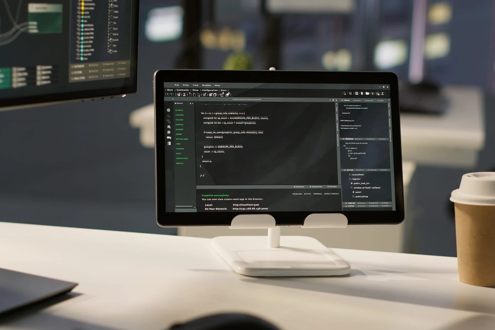 Code editor open on a tablet on a desk, representing frontend and backend development