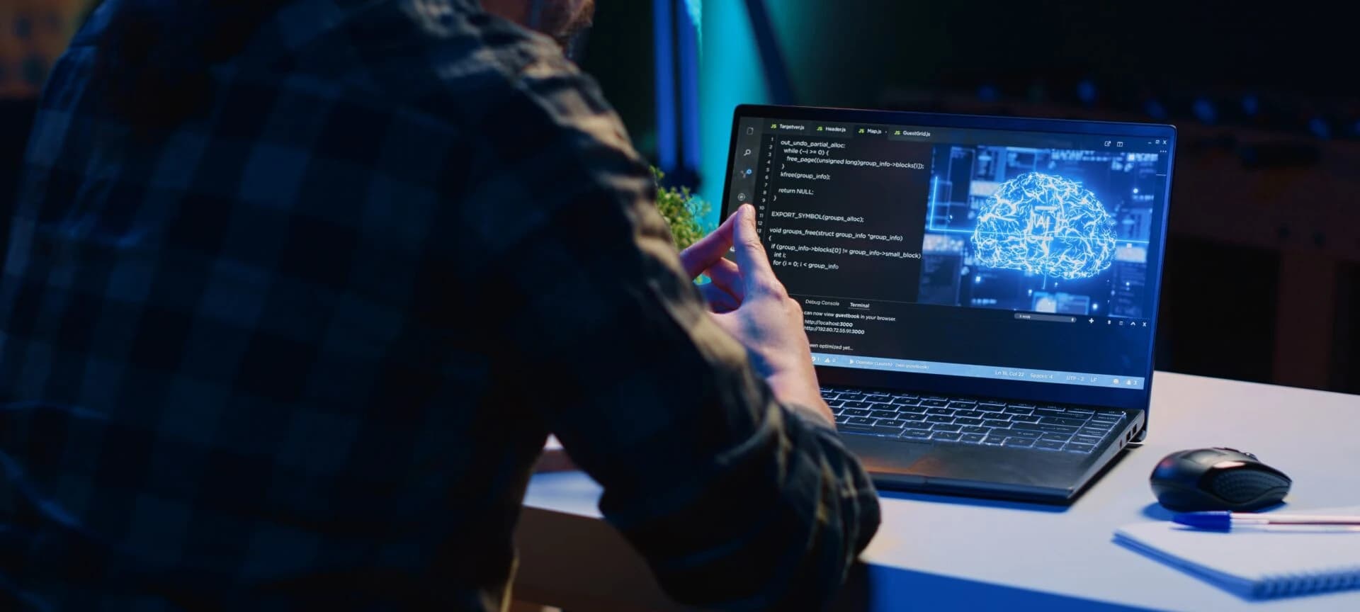 Engineer at a laptop reviewing a system dashboard, representing DevOps and CI/CD operations